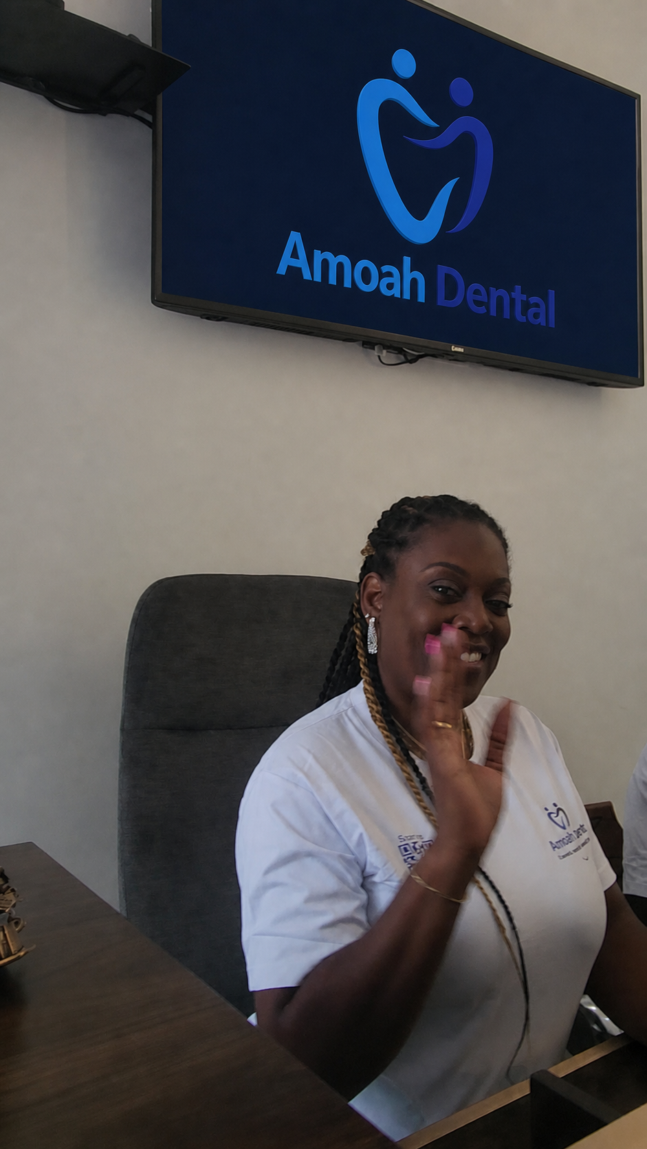 A member of the Amoah Dental clinical team welcoming visitors